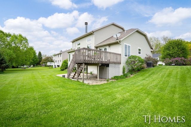 5348 Cristo Dr NE, Rockford, MI 49341 - back of property featuring a wooden deck, stairs, central AC unit, and a lawn