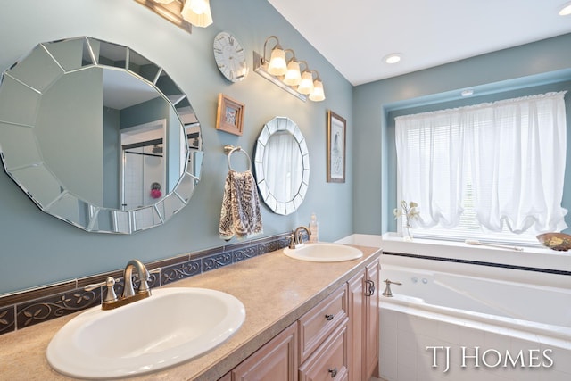 5348 Cristo Dr NE, Rockford, MI 49341 - full bath featuring double vanity, a garden tub, and an enclosed shower