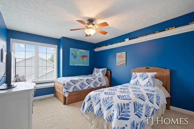 5348 Cristo Dr NE, Rockford, MI 49341 - bedroom with light colored carpet, baseboards, a ceiling fan, and a textured ceiling