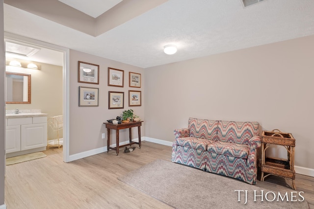 5348 Cristo Dr NE, Rockford, MI 49341 - sitting room featuring light wood-type flooring and baseboards