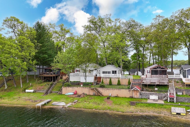 10138 S Lakeside Ridge Rd, Baldwin, MI 49304 - rear view of property featuring stairway and a deck with water view