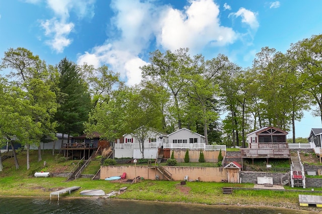 10138 S Lakeside Ridge Rd, Baldwin, MI 49304 - back of property featuring stairway and a deck with water view