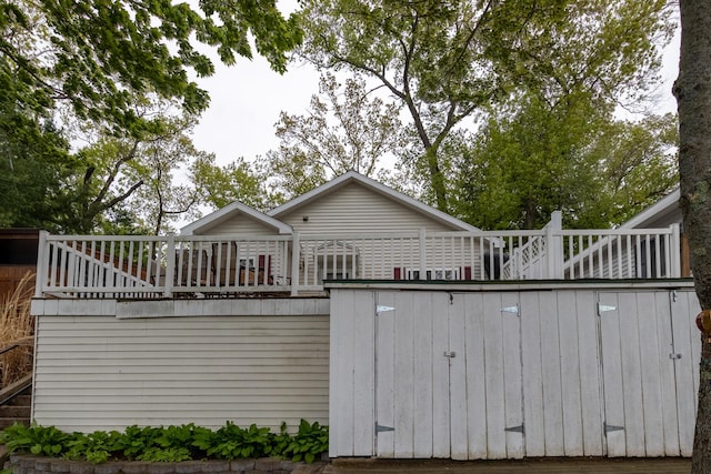 10138 S Lakeside Ridge Rd, Baldwin, MI 49304 - rear view of property with a wooden deck