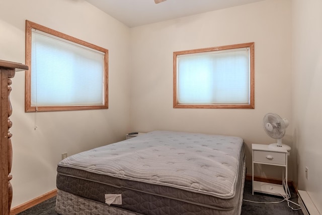 10138 S Lakeside Ridge Rd, Baldwin, MI 49304 - bedroom featuring carpet floors, baseboards, and a baseboard radiator