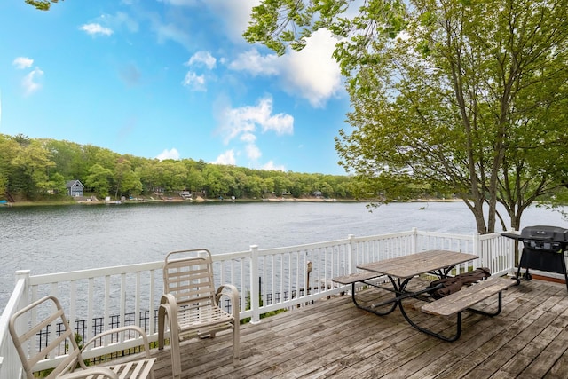 10138 S Lakeside Ridge Rd, Baldwin, MI 49304 - deck featuring a water view and grilling area