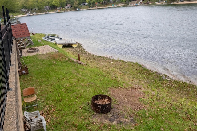 10138 S Lakeside Ridge Rd, Baldwin, MI 49304 - water view with an outdoor fire pit