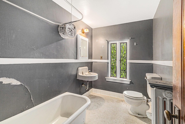3261 Sherbourne Rd, Detroit, MI 48221 - full bathroom with a freestanding bath, toilet, tile patterned floors, a sink, and radiator