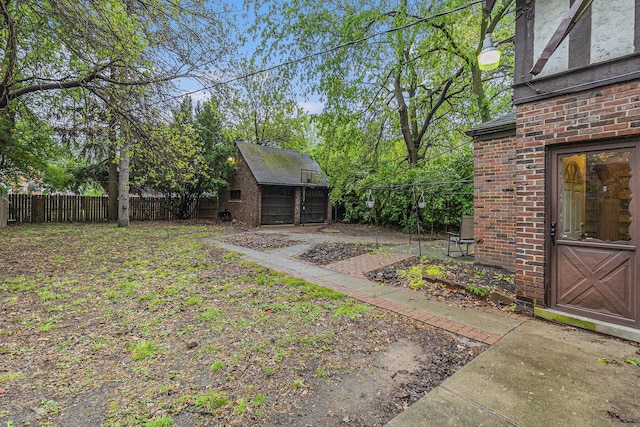 3261 Sherbourne Rd, Detroit, MI 48221 - view of yard with an outdoor structure and a garage