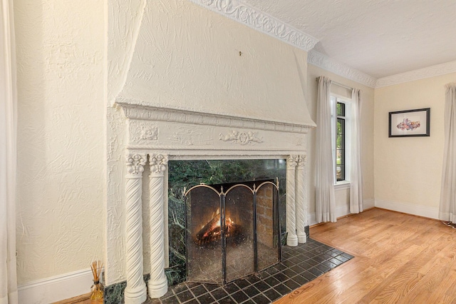 3261 Sherbourne Rd, Detroit, MI 48221 - detailed view of a high end fireplace, wood finished floors, baseboards, crown molding, and a textured wall