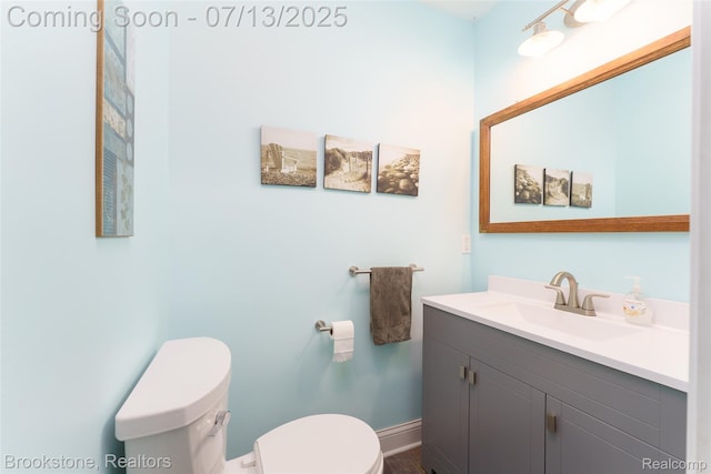 6245 Ray Rd, Swartz Creek, MI 48473 - bathroom featuring toilet and vanity