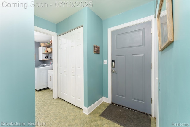 6245 Ray Rd, Swartz Creek, MI 48473 - entryway with tile patterned floors and washer and clothes dryer