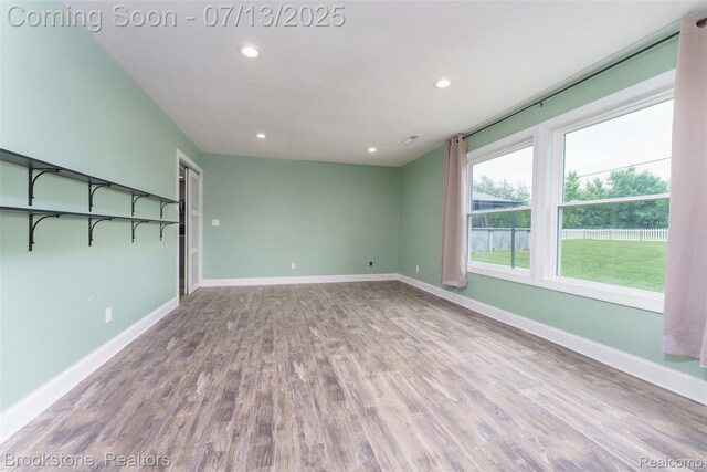 6245 Ray Rd, Swartz Creek, MI 48473 - empty room with recessed lighting and wood finished floors