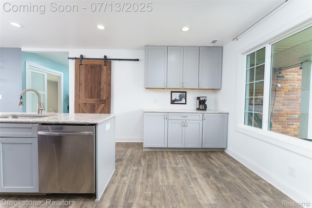 6245 Ray Rd, Swartz Creek, MI 48473 - kitchen featuring dishwasher, gray cabinetry, wood finished floors, a barn door, and recessed lighting