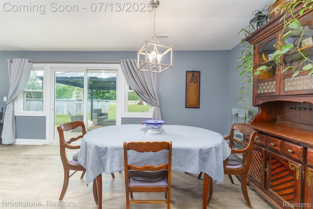 6245 Ray Rd, Swartz Creek, MI 48473 - dining space featuring a chandelier and healthy amount of natural light