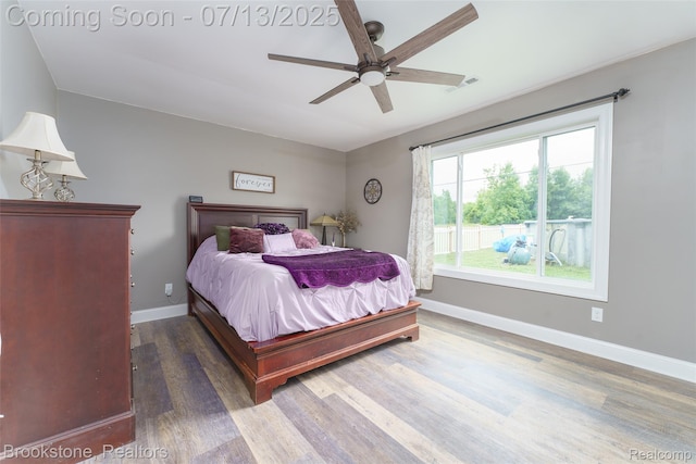 6245 Ray Rd, Swartz Creek, MI 48473 - bedroom with wood finished floors and a ceiling fan