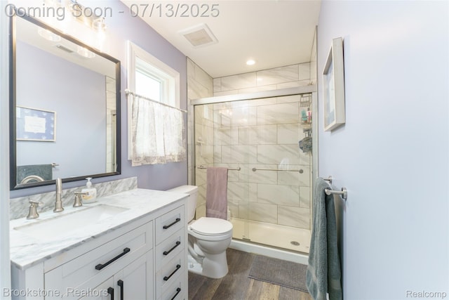 6245 Ray Rd, Swartz Creek, MI 48473 - full bath with vanity, wood finished floors, and a stall shower