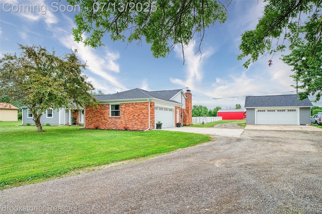6245 Ray Rd, Swartz Creek, MI 48473 - ranch-style home featuring brick siding, a chimney, driveway, an outbuilding, and a detached garage