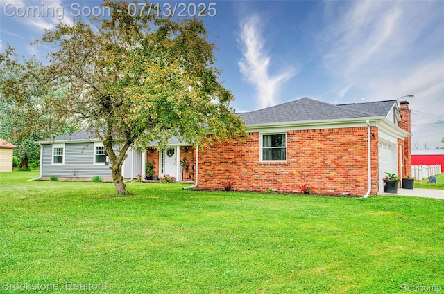 6245 Ray Rd, Swartz Creek, MI 48473 - ranch-style house featuring a garage, a front yard, and brick siding