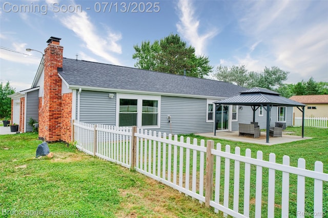 6245 Ray Rd, Swartz Creek, MI 48473 - view of front of property featuring a gazebo, roof with shingles, a chimney, and a patio