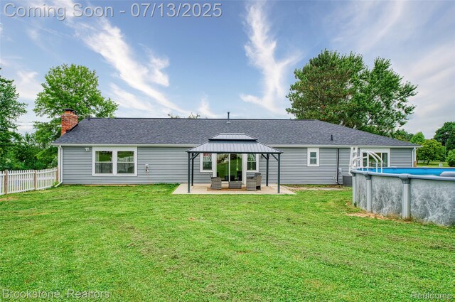 6245 Ray Rd, Swartz Creek, MI 48473 - rear view of house featuring a gazebo, a chimney, a shingled roof, and a patio