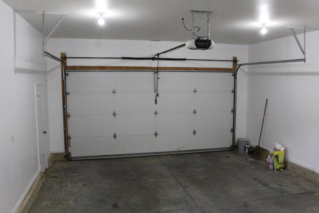 151 Ernest St, Brooklyn, MI 49230 - garage featuring a garage door opener and baseboards