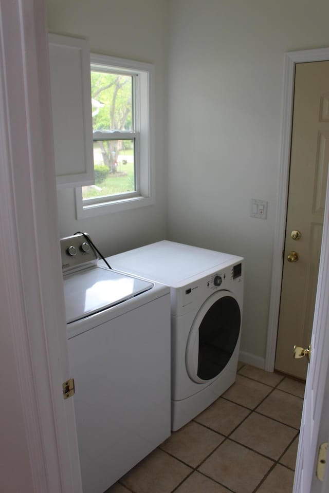 151 Ernest St, Brooklyn, MI 49230 - laundry area with washing machine and clothes dryer and light tile patterned flooring
