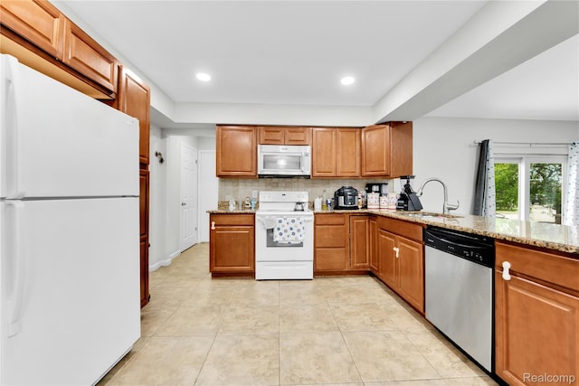 39321 Faith Dr, Sterling Heights, MI 48310 - kitchen with white appliances, a sink, light stone countertops, brown cabinetry, and light tile patterned flooring