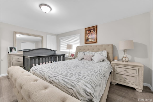 39321 Faith Dr, Sterling Heights, MI 48310 - bedroom featuring baseboards and dark wood-style flooring