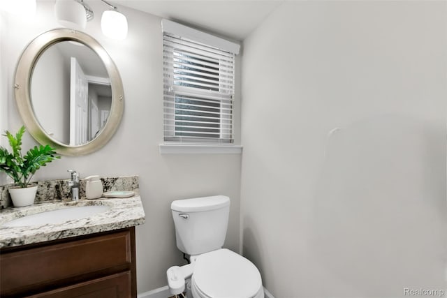 39321 Faith Dr, Sterling Heights, MI 48310 - half bath with vanity, toilet, and baseboards