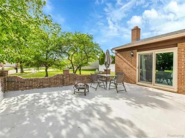 39321 Faith Dr, Sterling Heights, MI 48310 - view of patio / terrace featuring a fire pit and outdoor dining space