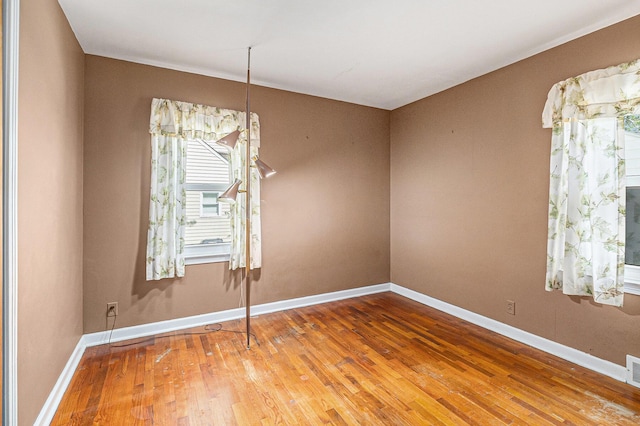2204 Lakeway Ave, Kalamazoo, MI 49001 - spare room featuring wood-type flooring and baseboards