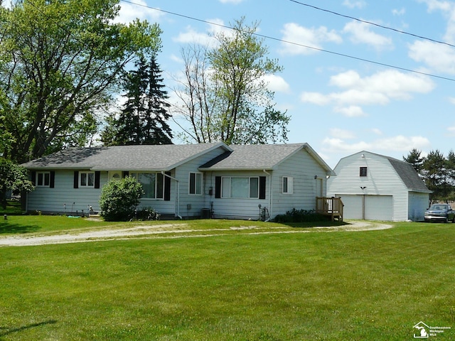 12067 Lewis Ave, Temperance, MI 48182 - view of front of home featuring an outbuilding, a garage, a front lawn, and dirt driveway