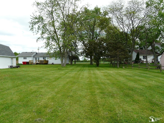 12067 Lewis Ave, Temperance, MI 48182 - view of green lawn featuring a deck