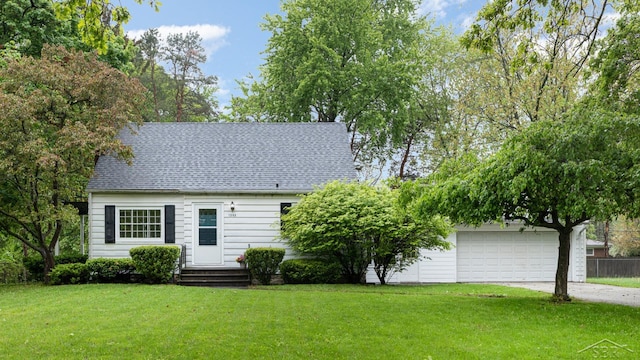 1355 Hemmeter Rd, Saginaw, MI 48638 - view of front facade featuring driveway, a front yard, an attached garage, and a shingled roof