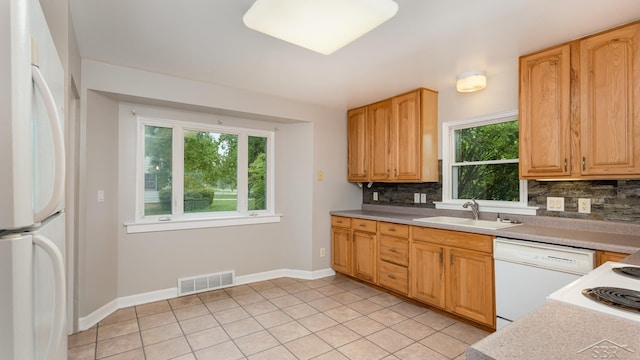 1355 Hemmeter Rd, Saginaw, MI 48638 - kitchen with white appliances, a sink, tasteful backsplash, and light tile patterned floors