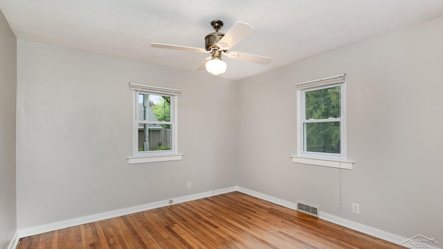 1355 Hemmeter Rd, Saginaw, MI 48638 - spare room featuring healthy amount of natural light, baseboards, and wood finished floors
