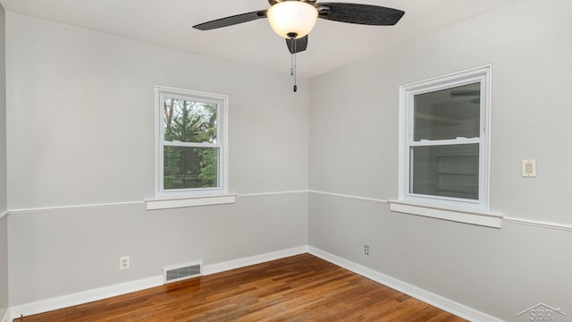 1355 Hemmeter Rd, Saginaw, MI 48638 - spare room with baseboards, a ceiling fan, and wood finished floors