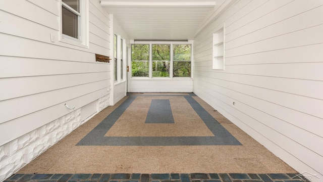 1355 Hemmeter Rd, Saginaw, MI 48638 - corridor featuring carpet and wooden walls