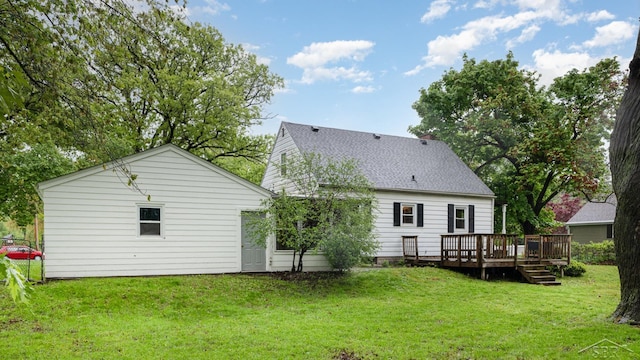 1355 Hemmeter Rd, Saginaw, MI 48638 - rear view of property featuring a deck, roof with shingles, and a yard