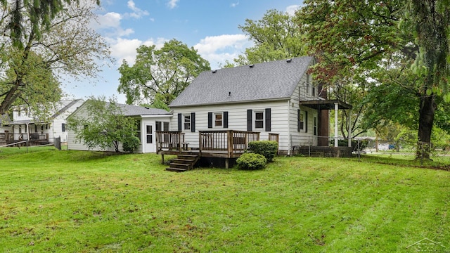 1355 Hemmeter Rd, Saginaw, MI 48638 - back of property featuring roof with shingles and a wooden deck