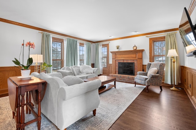 3638 Bellflower Dr, Portage, MI 49024 - living room with ornamental molding, a fireplace, wainscoting, and dark wood-style flooring
