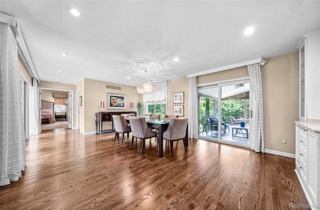 5259 Echo Rd, Bloomfield Hills, MI 48302 - dining room with a chandelier, wood finished floors, recessed lighting, and baseboards