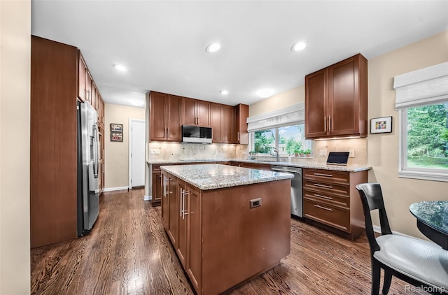 5259 Echo Rd, Bloomfield Hills, MI 48302 - kitchen featuring black appliances, a center island, dark wood-style floors, decorative backsplash, and recessed lighting