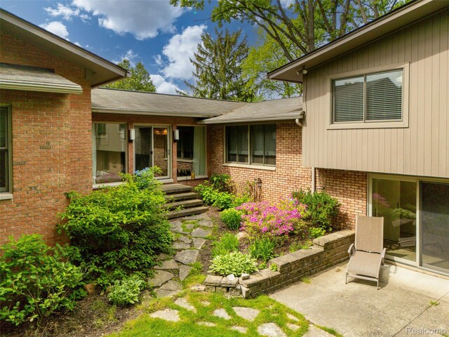 5259 Echo Rd, Bloomfield Hills, MI 48302 - property entrance with a patio and brick siding
