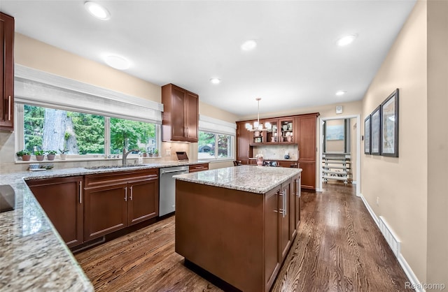 5259 Echo Rd, Bloomfield Hills, MI 48302 - kitchen featuring stainless steel dishwasher, a sink, healthy amount of natural light, a chandelier, and recessed lighting
