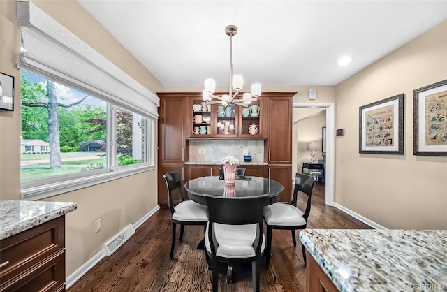 5259 Echo Rd, Bloomfield Hills, MI 48302 - dining area featuring a chandelier, baseboards, and dark wood finished floors