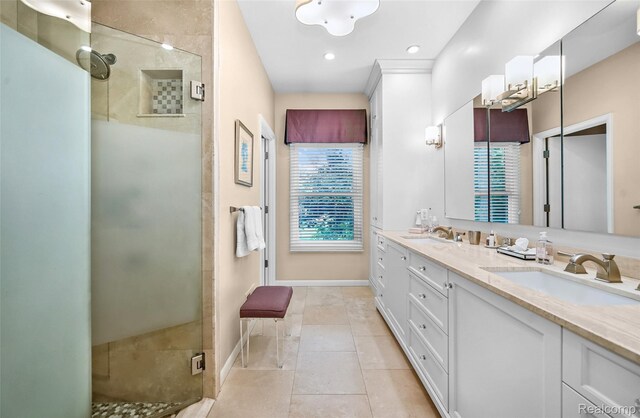 5259 Echo Rd, Bloomfield Hills, MI 48302 - bathroom with double vanity, a stall shower, tile patterned flooring, baseboards, and recessed lighting