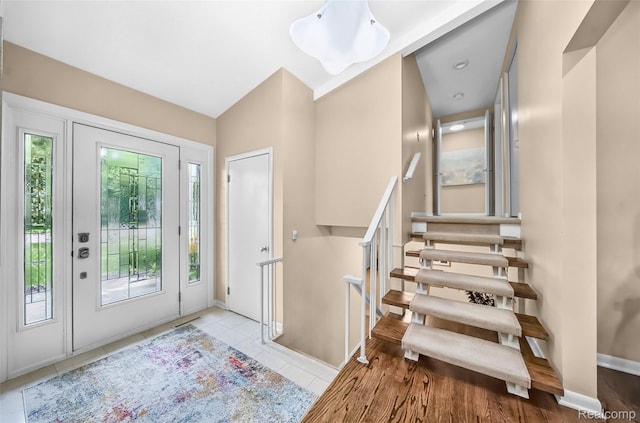 5259 Echo Rd, Bloomfield Hills, MI 48302 - tiled foyer featuring stairway and baseboards