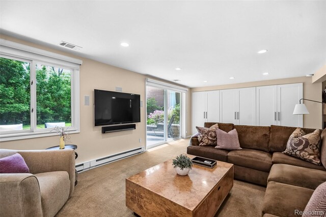 5259 Echo Rd, Bloomfield Hills, MI 48302 - carpeted living area featuring a baseboard heating unit, plenty of natural light, and recessed lighting