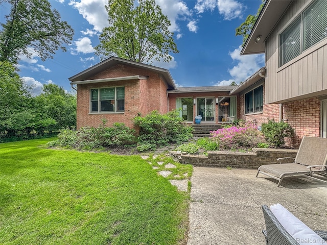 5259 Echo Rd, Bloomfield Hills, MI 48302 - view of front of house with brick siding and a front lawn